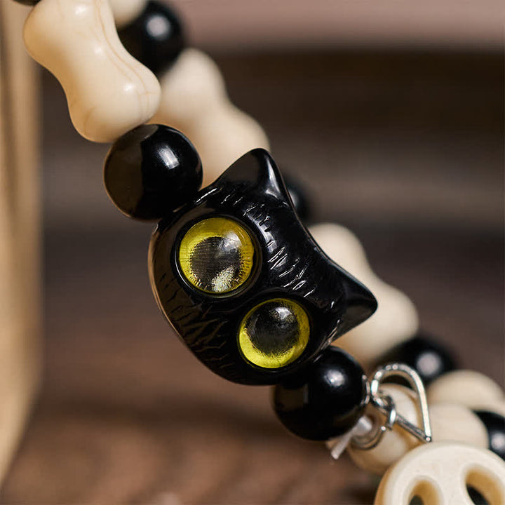 Buddha Stones Schwarzes Katzen-Perlenarmband mit Totenkopfmotiv - image 12