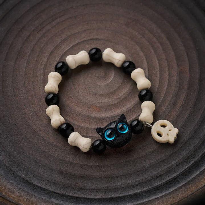Buddha Stones Schwarzes Katzen-Perlenarmband mit Totenkopfmotiv - image 1