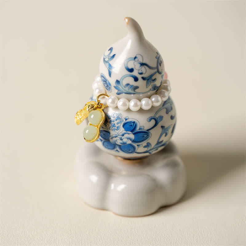 Buddha Stones Drehbarer Kürbis aus blauer und weißer Keramik, Lotusblume, für ein achtsames Wohnambiente - Weißer Sockel, ca. 4,8 cm × 4,8 cm × 8,5 cm - image 0