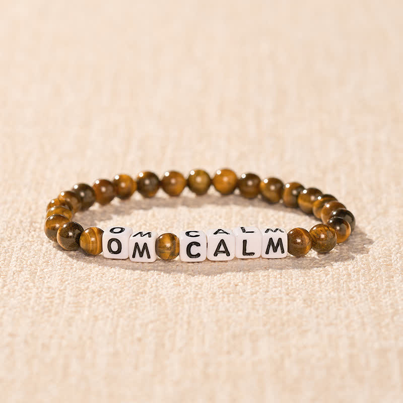 Buddha Stones Tigerauge OM CALM Buchstabenperlen Mut-Armband - image 1