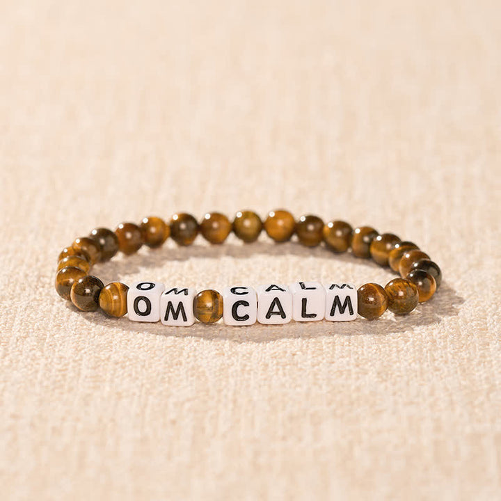 Buddha Stones Tigerauge OM CALM Buchstabenperlen Mut-Armband - image 1