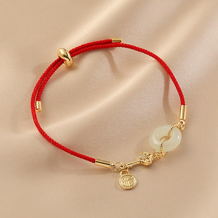 Buddha Stones 18 Karat vergoldetes Hetian-Jade-Armband mit Friedensschnalle, Fu-Charakter, Glück, rotes Seil