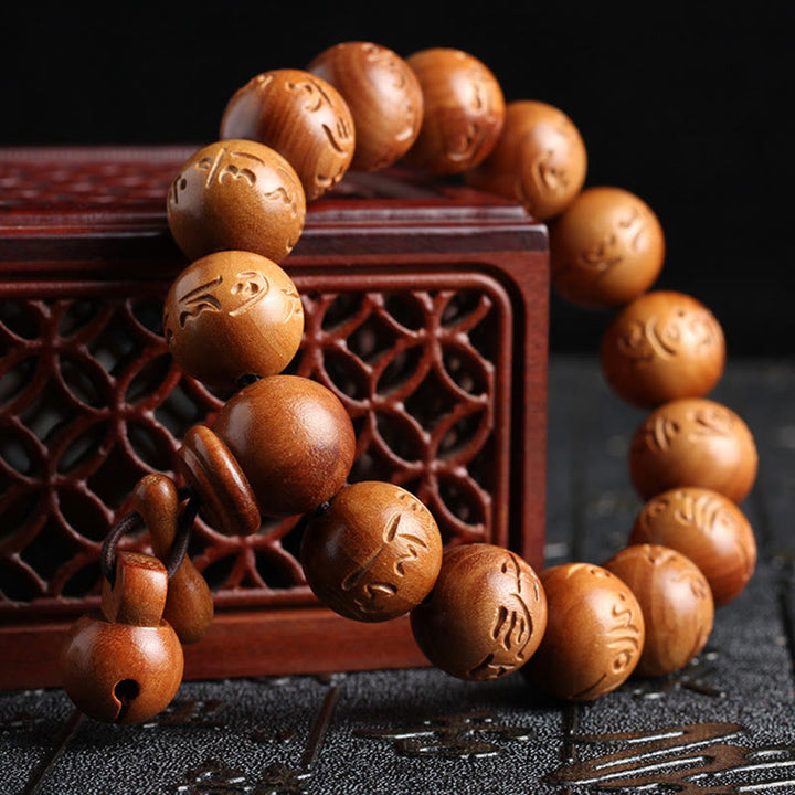 Buddha Stones Armband aus natürlichem tibetischem Pfirsichholz mit Om Mani Padme Hum-Gravur zur Abwehr böser Geister