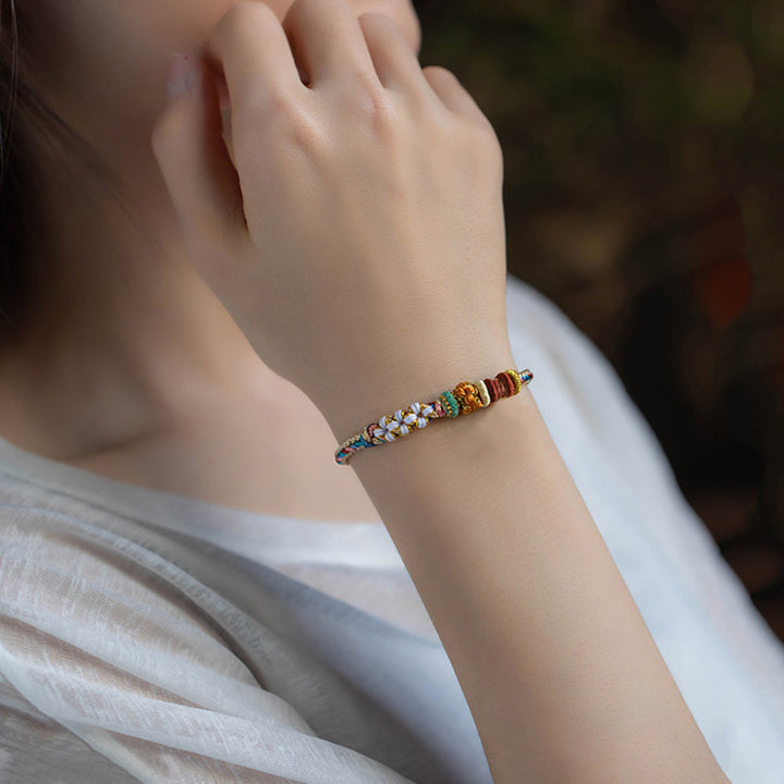 Handgefertigtes geflochtenes Armband in Dunhuang-Farbe mit Pfirsichblütenmuster von Buddha Stones