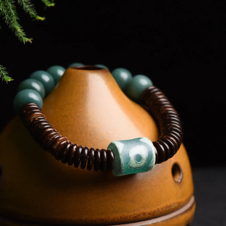 Tibetisches Cyan Bodhi Seed Dzi Perlen-Kokosnussschalen-Armband, das böse Geister fernhält