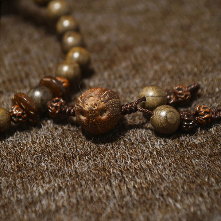 Buddha Stones Mala-Armband aus tibetischem Sandelholz mit Schutzamulett - image 4