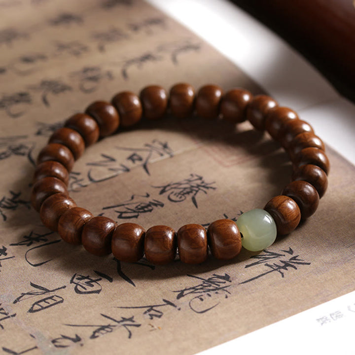Buddha Stones Armband aus natürlichem Abelia Biflora-Holz, Hetian-Jade und Bambusperle, das böse Geister abwehrt