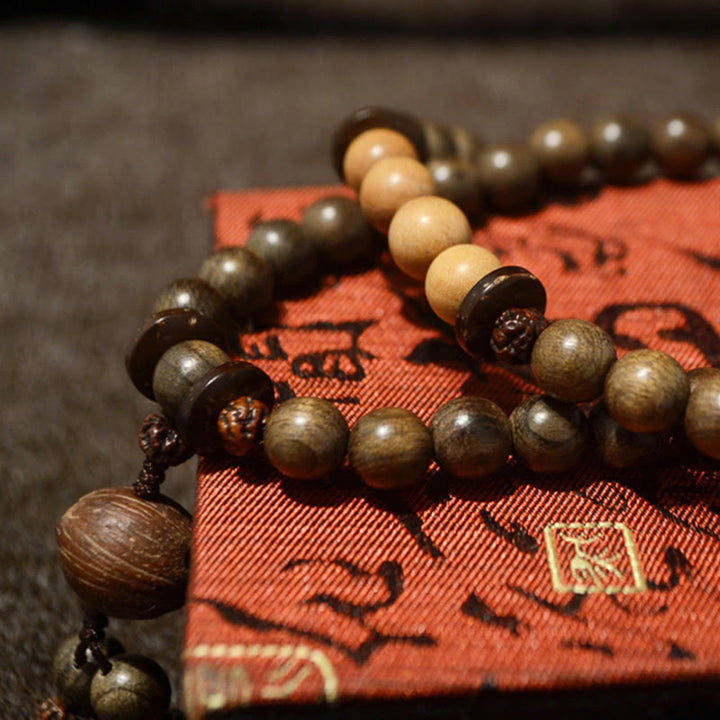 Buddha Stones Mala-Armband aus tibetischem Sandelholz mit Schutzamulett - image 7