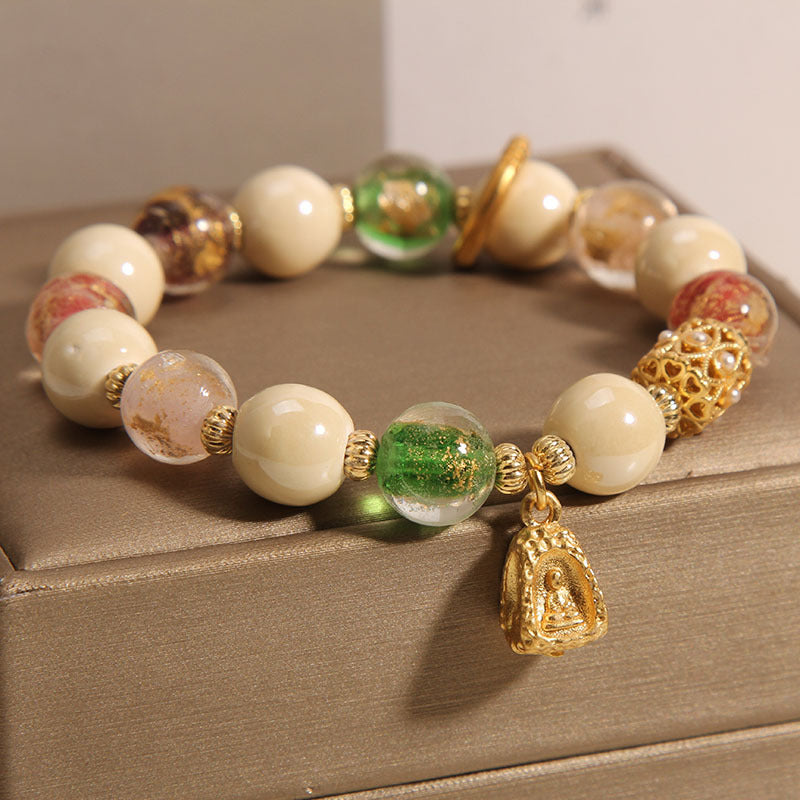 Buddha Stones tibetisches Liuli-Glasperlen-Armband mit Buddha-Lotus-Charm und Aufklärungsmotiv