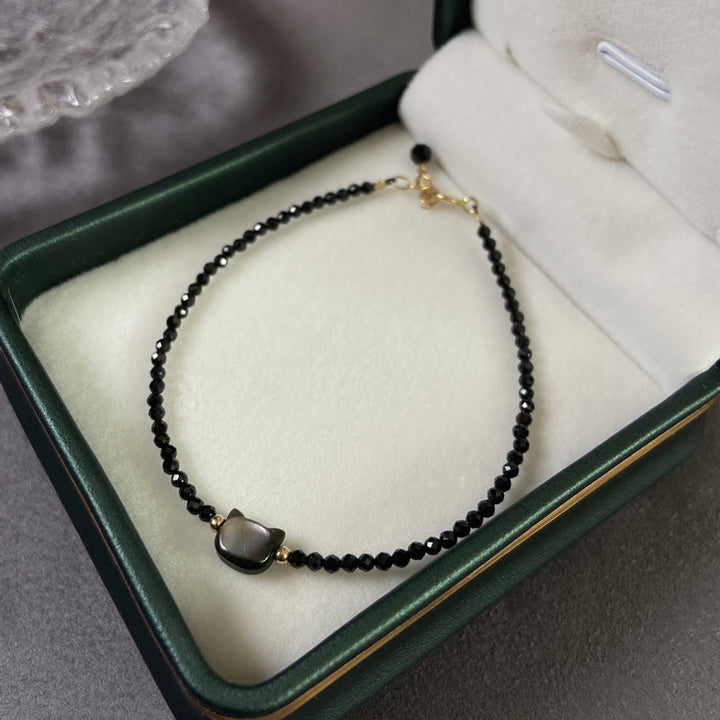 Buddha Stones 14K vergoldetes schwarzes Spinell- Weiß Kristall-Heilarmband mit süßer Katze aus Tridacna-Stein - image 2