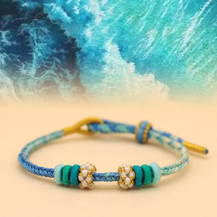 Buddha Stones Handgefertigtes achtfädiges Friedensknoten-Pfirsichblütenknoten-Glücksseil-geflochtenes Armband - Blue Sea (Blaugrün) (Handgelenkumfang 14–18 cm) - image 10