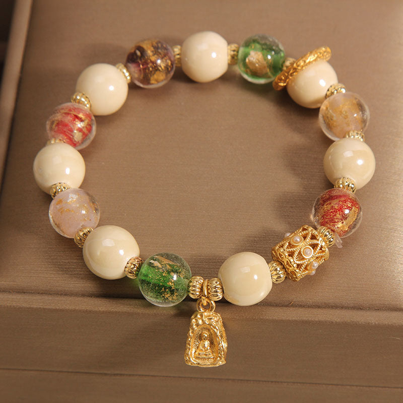 Buddha Stones tibetisches Liuli-Glasperlen-Armband mit Buddha-Lotus-Charm und Aufklärungsmotiv