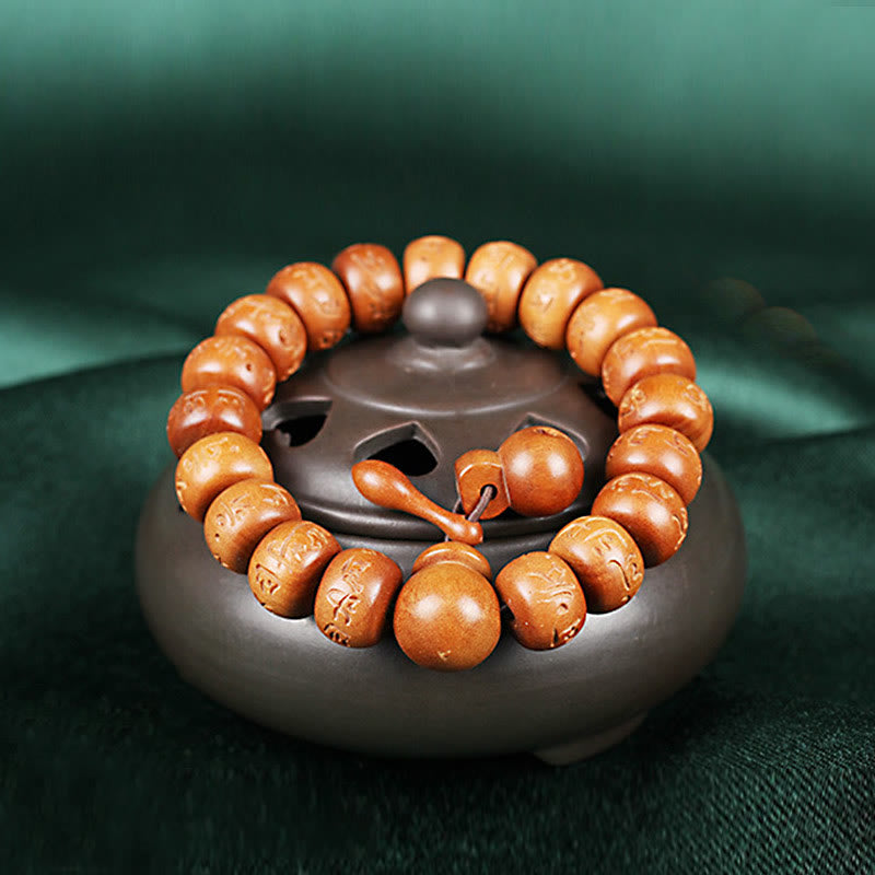 Buddha Stones Armband aus natürlichem tibetischem Pfirsichholz mit Om Mani Padme Hum-Gravur zur Abwehr böser Geister