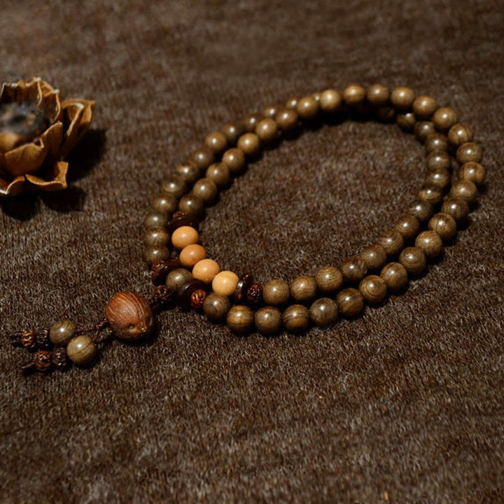 Buddha Stones Mala-Armband aus tibetischem Sandelholz mit Schutzamulett - image 1