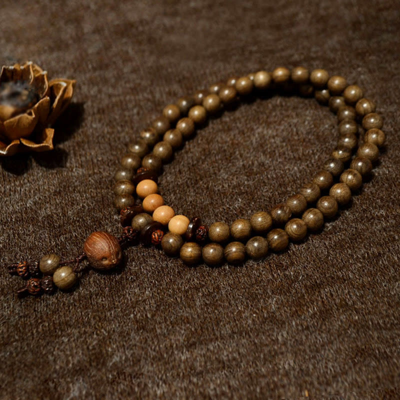 Buddha Stones Mala-Armband aus tibetischem Sandelholz mit Schutzamulett - image 1