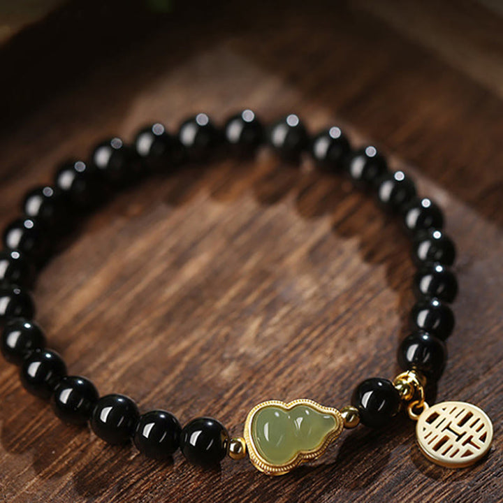 Natürliches schwarzes Obsidian-Hetian-Jade-Kürbis-Armband mit doppelter Glückskraft