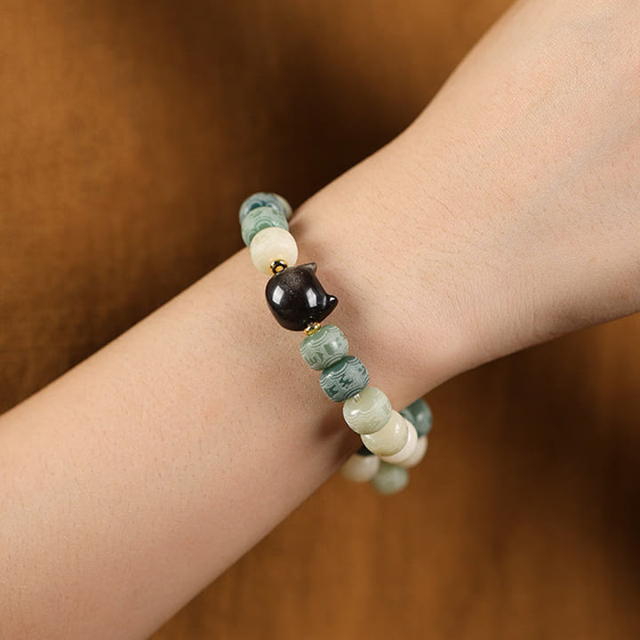 Buddha Stones Bodhi Seed Silber glänzendes Obsidian-Katzenkopf-Armband mit Om Mani Padme Hum-Gravur für Harmonie - image 12