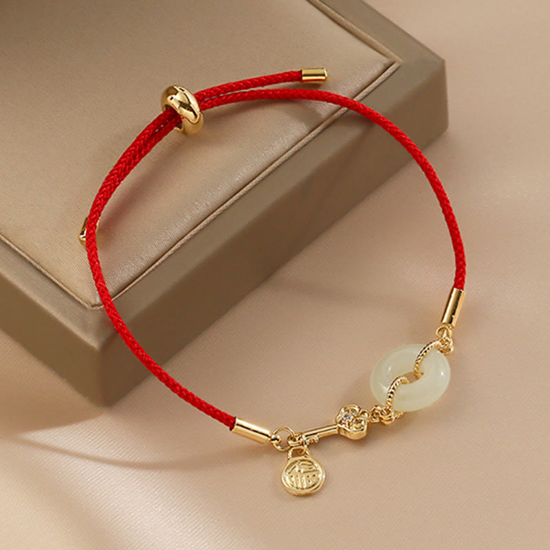 Buddha Stones 18 Karat vergoldetes Hetian-Jade-Armband mit Friedensschnalle, Fu-Charakter, Glück, rotes Seil