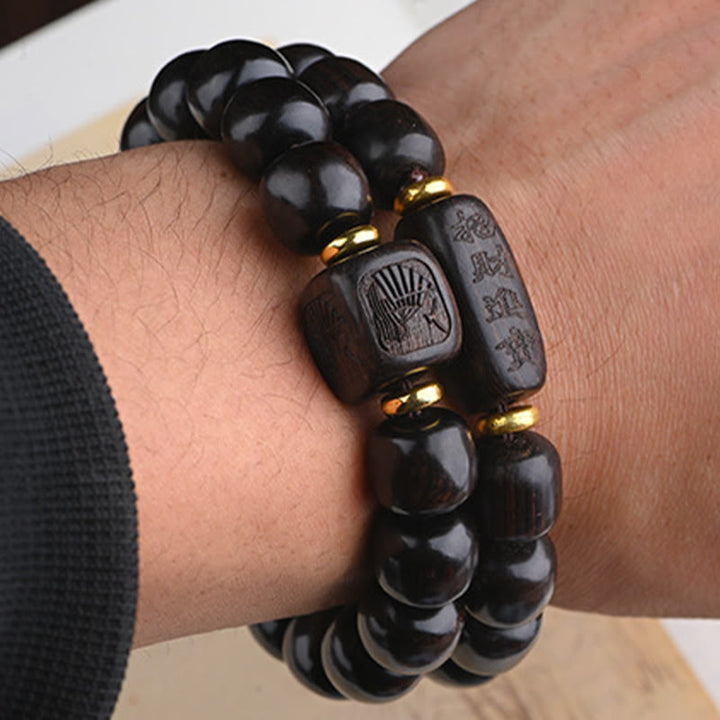 Buddha Stones Tibetisches Ebenholz-Fassperlen-Armband mit Glücks- und Schatz-Balance