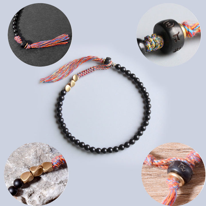 Buddha Stones Handgefertigtes tibetisches schwarzes Onyx-Quastenarmband