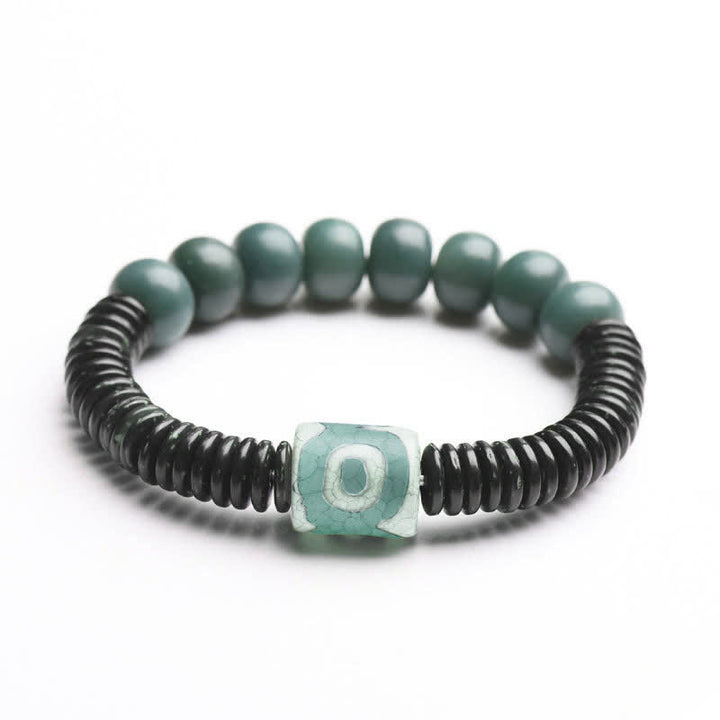 Tibetisches Cyan Bodhi Seed Dzi Perlen-Kokosnussschalen-Armband, das böse Geister fernhält