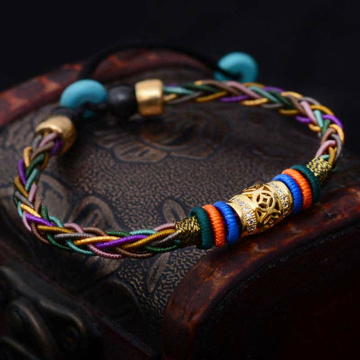 Buddha Stones, tibetisches handgefertigtes Acht-Faden-Knoten-Kupfer-Münzen-Glücks-Gewebe-Schnur-Armband - image 1