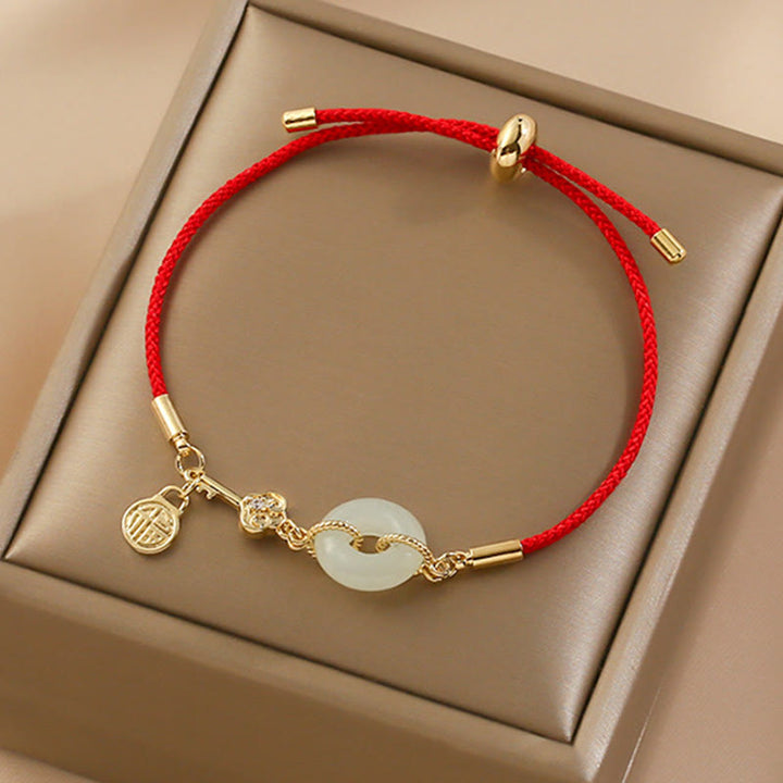 Buddha Stones 18 Karat vergoldetes Hetian-Jade-Armband mit Friedensschnalle, Fu-Charakter, Glück, rotes Seil