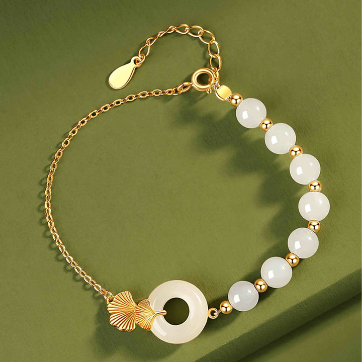 Buddha Stones 925 Sterling Silber Hetian Weiß Jade Friedensschnalle Ginkgoblatt Glücksarmband - image 1