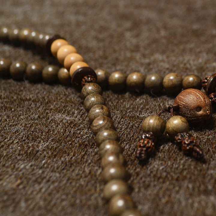 Buddha Stones Mala-Armband aus tibetischem Sandelholz mit Schutzamulett - image 13