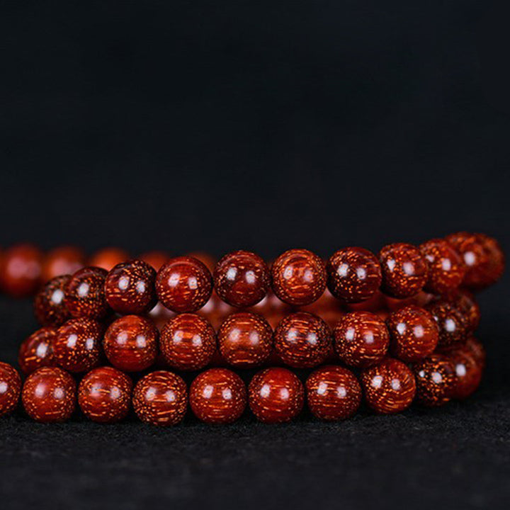 Buddha Stones Tibetisches kleines Blatt-Balance-Armband aus rotem Sandelholz