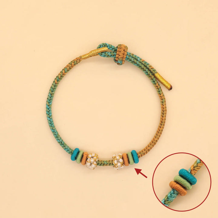 Buddha Stones Handgefertigtes achtfädiges Friedensknoten-Pfirsichblütenknoten-Glücksseil-geflochtenes Armband - image 3