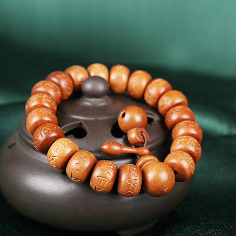 Buddha Stones Armband aus natürlichem tibetischem Pfirsichholz mit Om Mani Padme Hum-Gravur zur Abwehr böser Geister