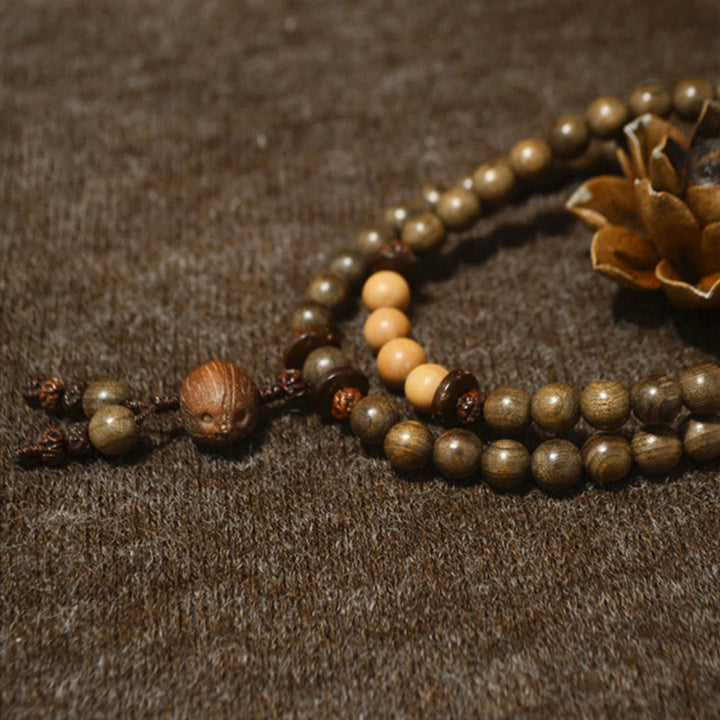 Buddha Stones Mala-Armband aus tibetischem Sandelholz mit Schutzamulett - image 8