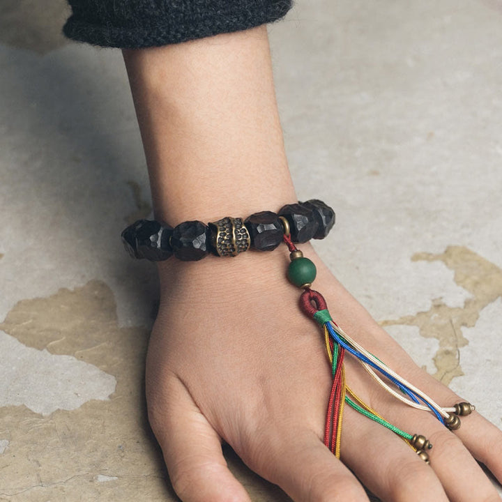 Buddha Stones Armband aus tibetischem Ebenholz und Kupfer mit Friedensquaste - image 4