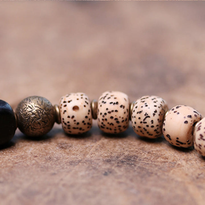 Buddha Stones Tibetischer Bodhi-Samen, schwarzer Obsidian, Ebenholz, Kupfer, Friedensarmband