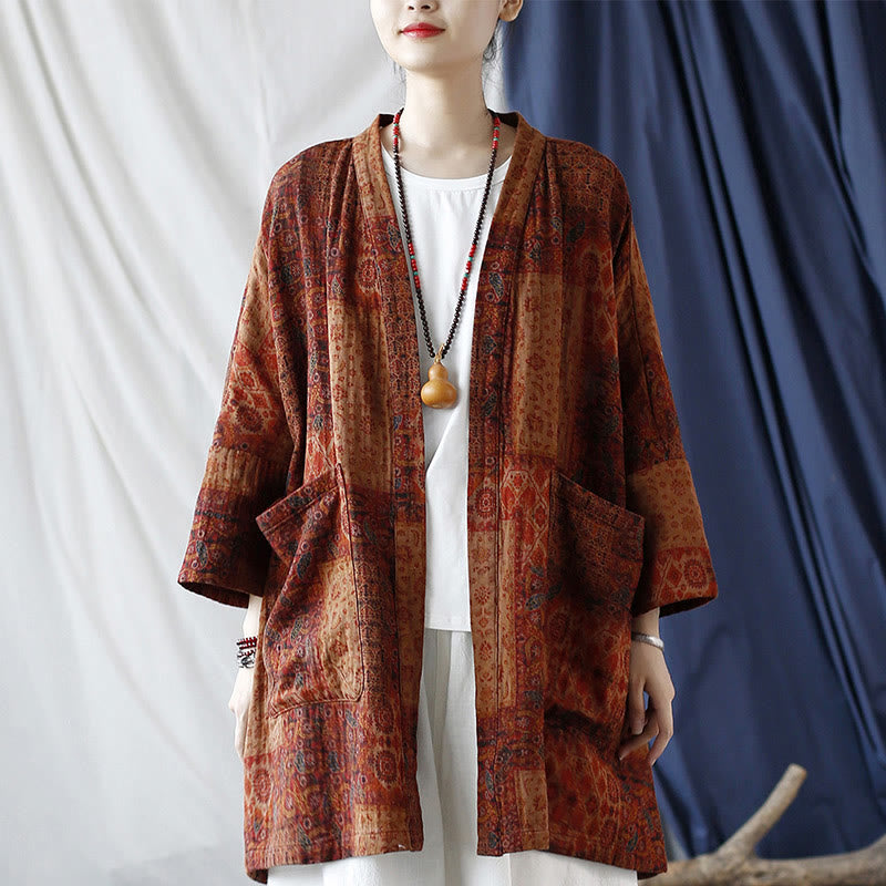 Buddha Stones – Orangefarbene Baumwolljacke mit geometrischem Blumenmuster und offener Vorderseite und Taschen