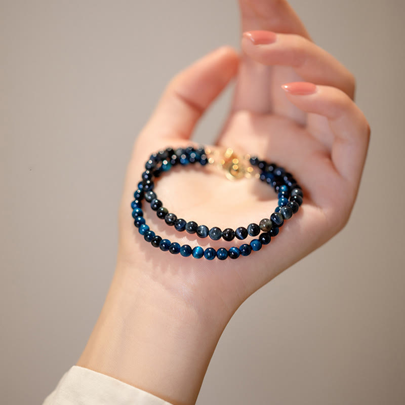 Buddha Stones natürliches blaues Tigerauge-Stein-Schutzkettenarmband