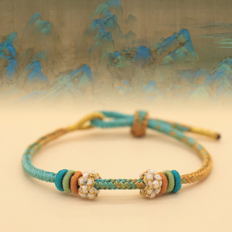 Buddha Stones Handgefertigtes achtfädiges Friedensknoten-Pfirsichblütenknoten-Glücksseil-geflochtenes Armband - Ein Panorama aus Flüssen und Bergen (Grün-Gelb) (Handgelenkumfang 14–18 cm) - image 1