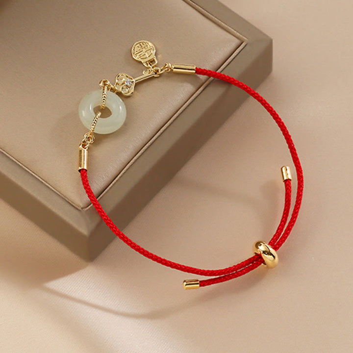 Buddha Stones 18 Karat vergoldetes Hetian-Jade-Armband mit Friedensschnalle, Fu-Charakter, Glück, rotes Seil