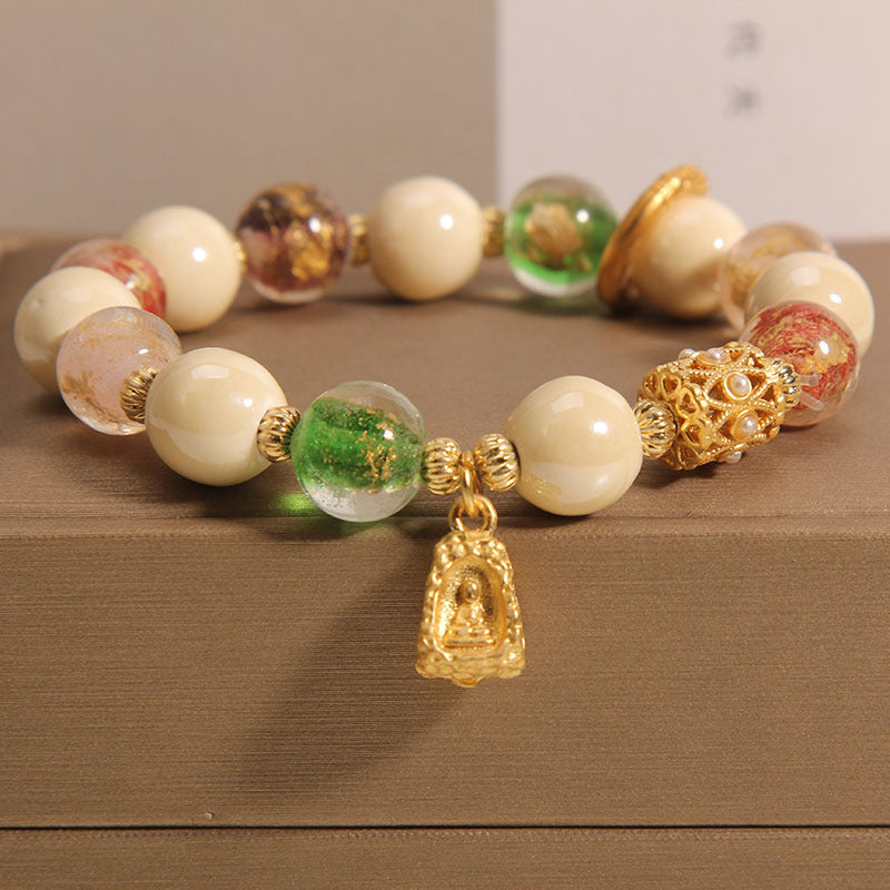 Buddha Stones tibetisches Liuli-Glasperlen-Armband mit Buddha-Lotus-Charm und Aufklärungsmotiv