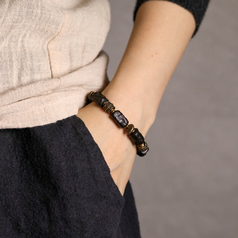 Buddha Stones Armband aus tibetischem Ebenholz und Kupfer – Symbol der Ruhe und des Friedens - image 1