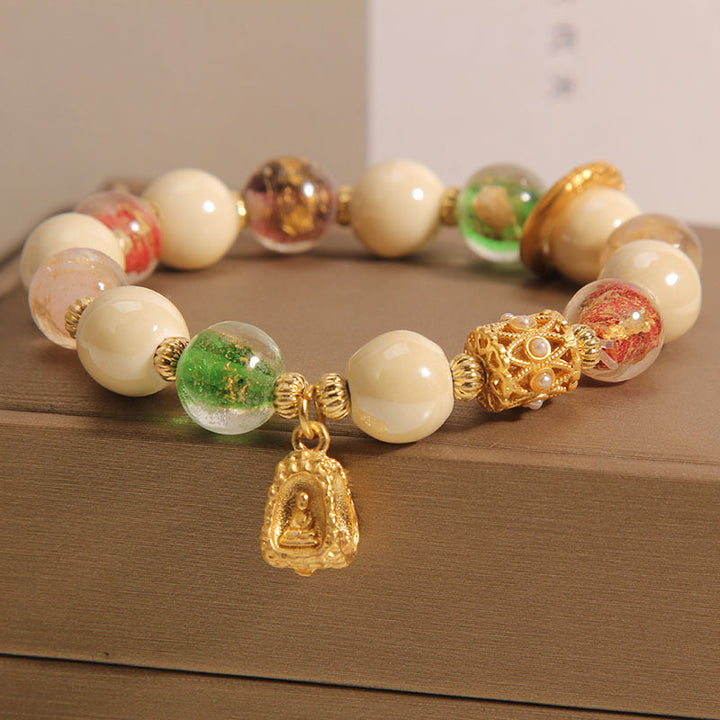 Buddha Stones tibetisches Liuli-Glasperlen-Armband mit Buddha-Lotus-Charm und Aufklärungsmotiv