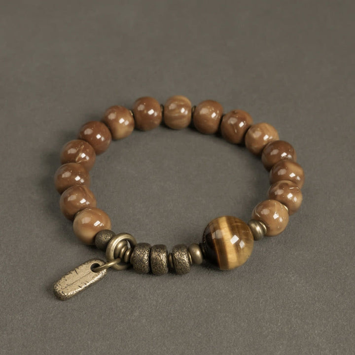 Buddha Stones, Kuka-Samen, Tigerauge, Goldglanz, Obsidian, Messing, Kupfer – Armband für Reichtum und Glück - Kuka-Samen & Tigerauge - 17–17,5 cm - image 0