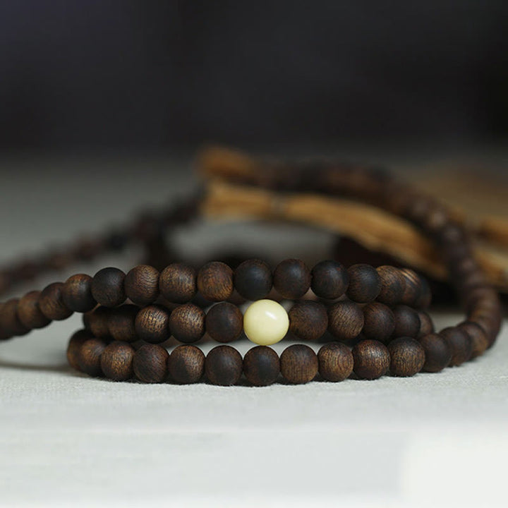 Buddha Stones 999 Gold Tarakan 108 Mala Perlen Adlerholz Bernstein Armband zur Abwehr böser Geister