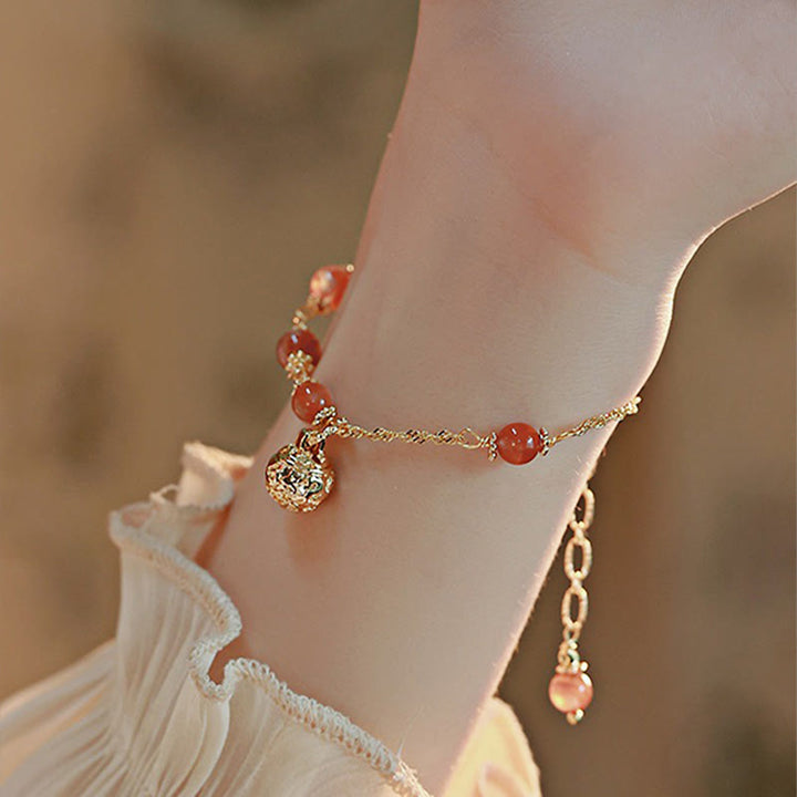 Buddha Stones, rotes Achat-Glocken-Anhänger-Kettenarmband