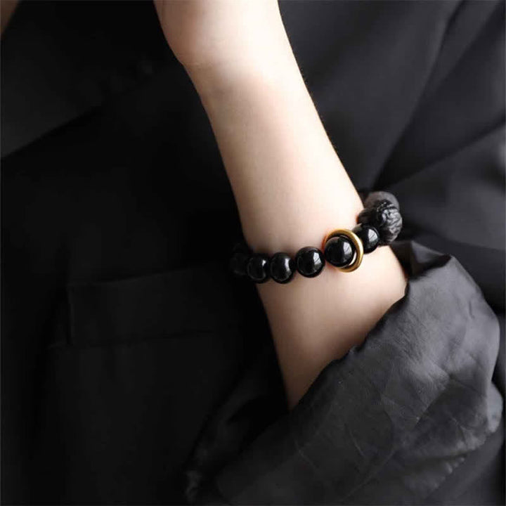 Schwarzes Obsidian-Silberglanz-Obsidian-Löwen-Stärke-Armband