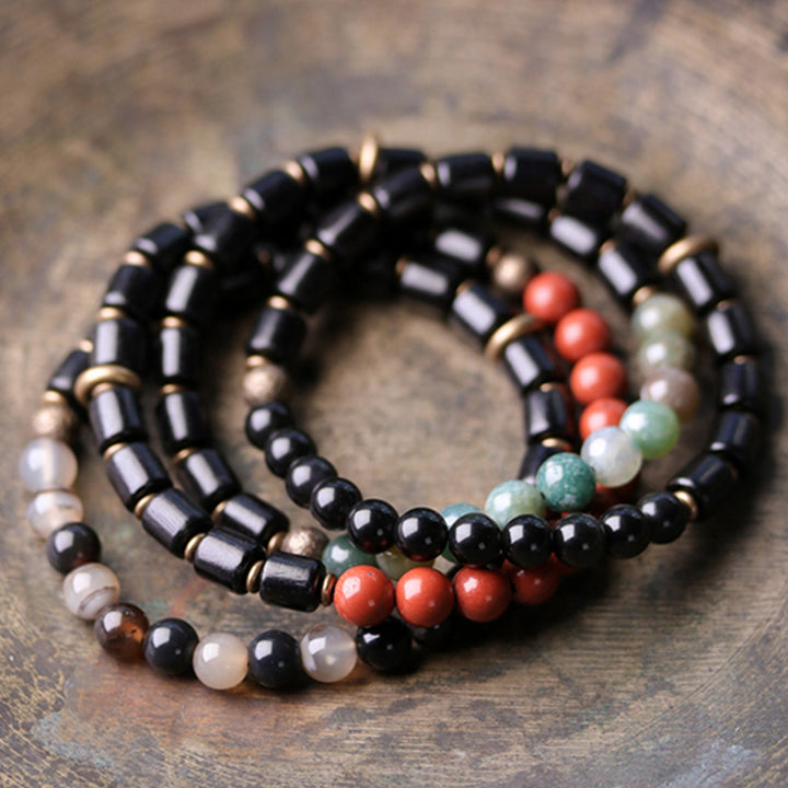 Armband mit Buddha Stonesn, Ebenholz, rotem Jaspis, Moos-Achat, Kristall, Kupfer, Friedenspaar