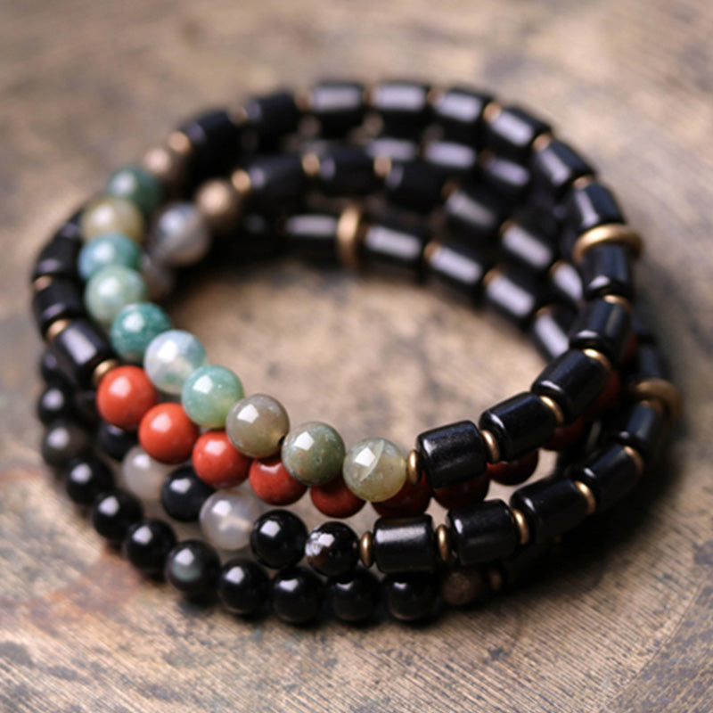 Armband mit Buddha Stonesn, Ebenholz, rotem Jaspis, Moos-Achat, Kristall, Kupfer, Friedenspaar