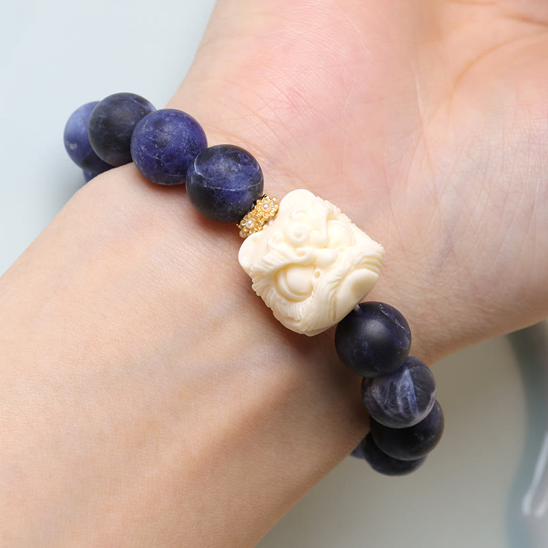 Armband mit Buddha Stonesn, Sodalith, Elfenbein, Früchten, tanzender Löwe, Halbmond, Harmonie