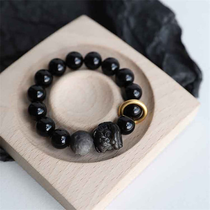 Schwarzes Obsidian-Silberglanz-Obsidian-Löwen-Stärke-Armband